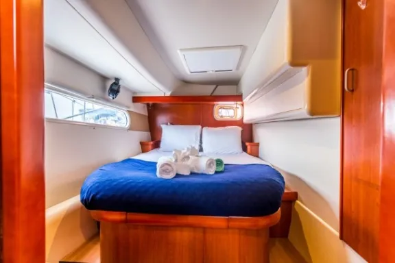 a bedroom with a blue seat