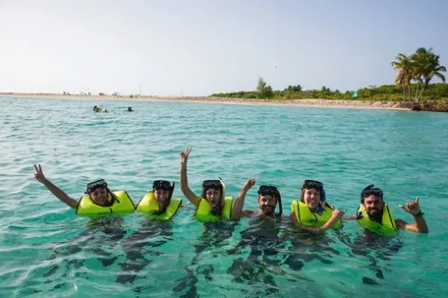 a group of people swimming in a body of water